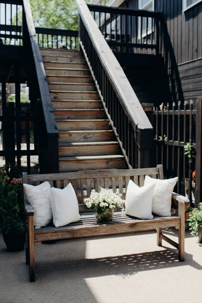 Welcoming Patio Bench with Fresh White Accents