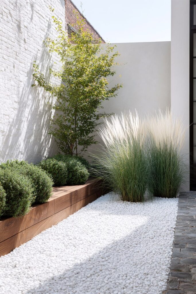 Contemporary Grass Border with White Pebbles