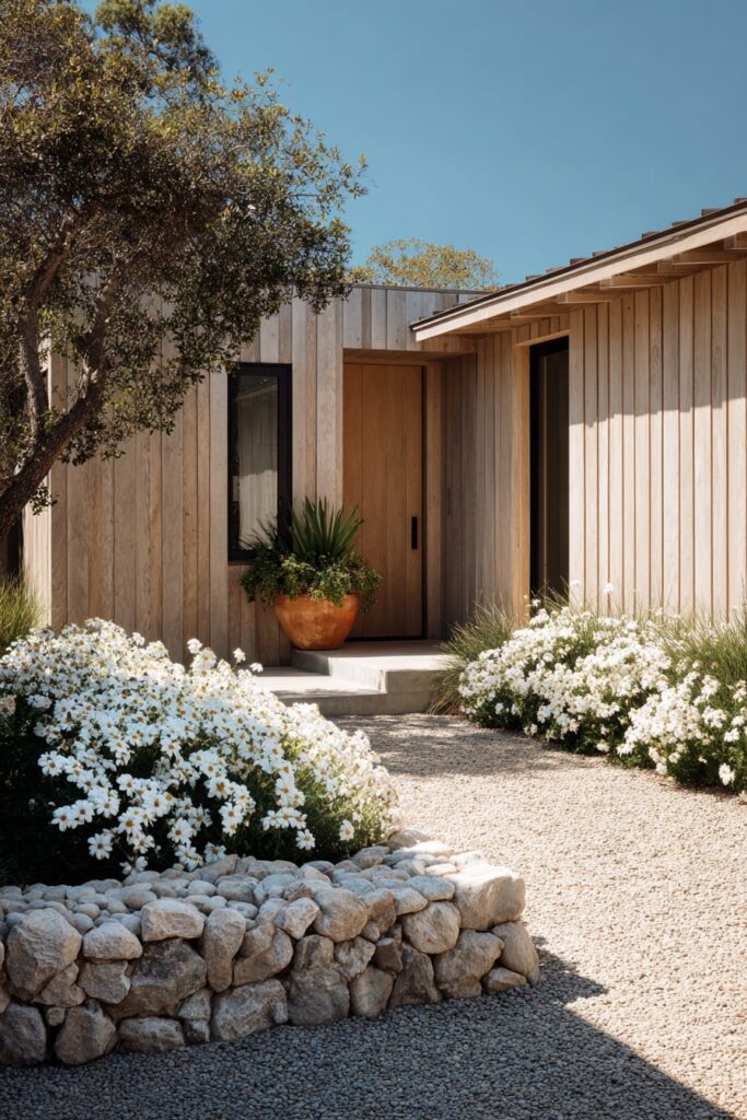 16. Soft Gravel Entryway with Daisy Clusters